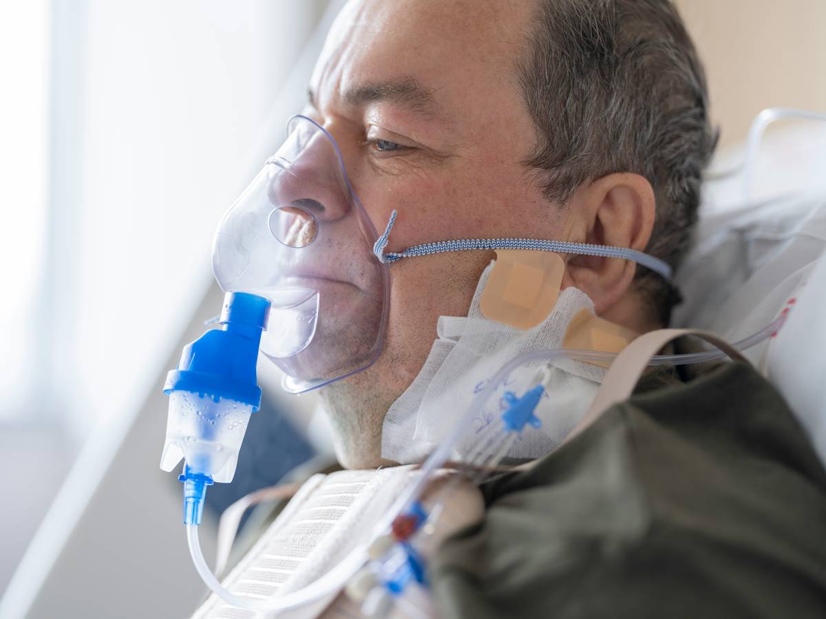 Woman practicing lung detox technique with hands on ribcage, eyes closed in calm focus